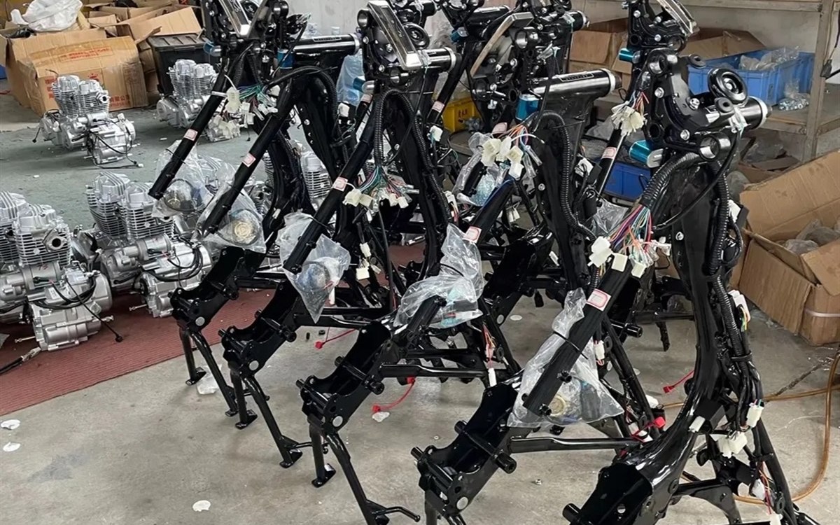 Motorcycle frames and parts prepared in workshop